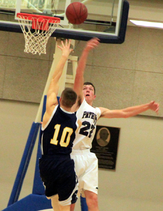 Summits Patrick Chmelik swats away a Logos shot attempt in the District Championship game.