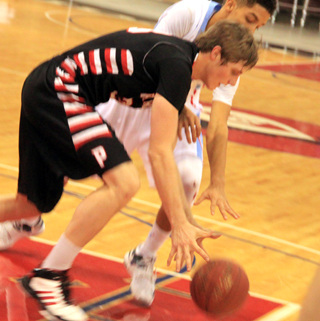 Lucas Arnzen goes after a loose ball against Lapwai.