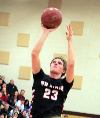 Lucas Arnzen scores 2 of his 22 points against Ambrose.