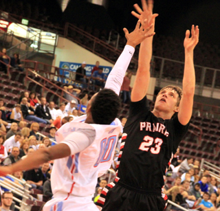 Lucas Arnzen gets a shot off over the block attempt by Lapwai.