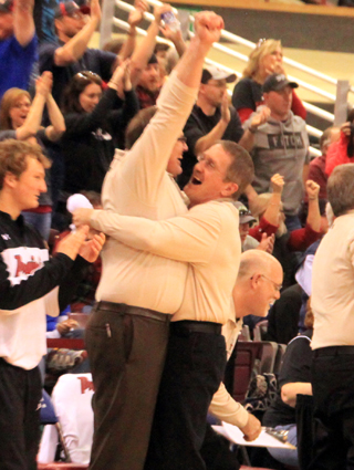 Kevin Chaffee hugs Teel Bruner as Teel celebrates Prairie's win.
