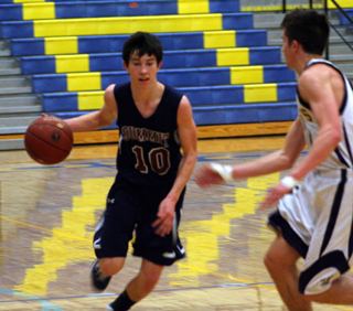 Tyler Krogh handles the ball against Logos. Photo by Steve Wherry.