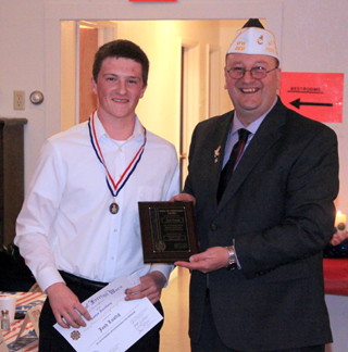 Josh Lustig receives his 1st place Voice of Democracy awards from Joe Riener.