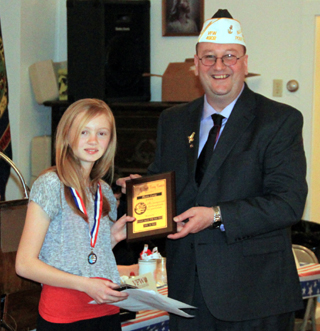 Mattie Lustig receives her awards from Joe Riener.