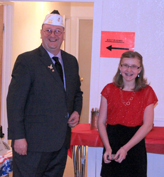 Molly Schwartz took second place in the VFWs Voice of Democracy contest. Third place winner Chaye Uptmor was unable to attend. She is shown with Joe Riener.