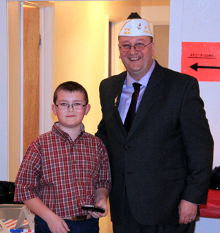 Tony Goeckner took third place in the VFWs Patriot's Pen contest. He is shown with Joe Riener.