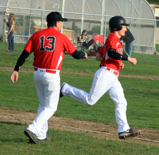 Calvin Hinkelman rounds first with Prairies first hit, as well as first RBI of the season. Devin Bruegeman scored from third on the play for Prairies first run of the season.