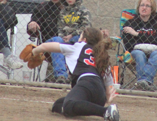 Faith Uhlenkott catches a short pop-up along the third base line.