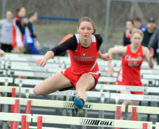 Mykaela McWilliams sails over a hurdle as she won easily in the 100 hurdles Saturday at Lapwai.