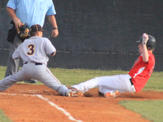 Devin Bruegeman slides into home with a run in the Wendell game.