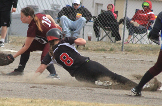 Hailey Danly slides safely into second with a stolen base against West Side.
