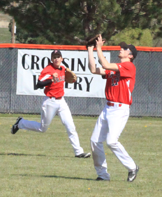 John Mager makes a catch in centerfield against Malad as Jace Perrin comes over to back up the play.