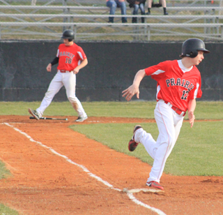 Nick Mager turns at first with an RBI single as you can see Calvin Hinkelman about to score in the background.