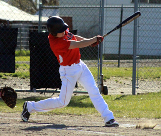 Brandon Anderson gets a hit at Nezperce.