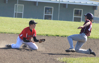 This Kamiah runner is out by a mile as 2nd baseman Jace Perrin waits with the ball on a steal attempt.