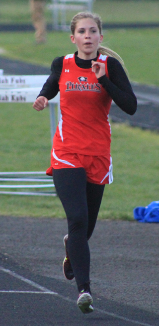 Chaye Uptmor was all alone in the lead in the 1600 by the end of the second lap.