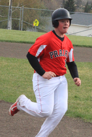 Dereck Arnzen pulls into third base against Highland.