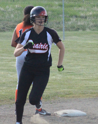 Hanna Ross heads for third with a triple against Asotin.