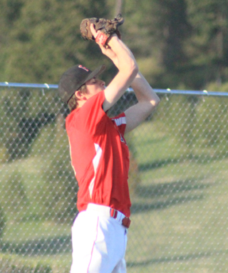 John Mager catches a fly ball for the final out against Troy.