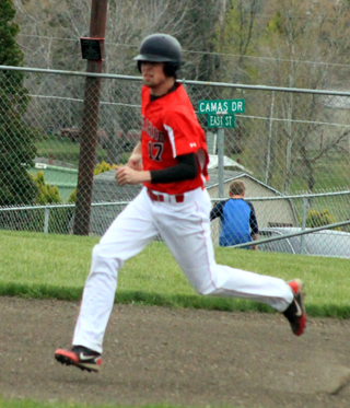 John Mager heads for second against Highland.