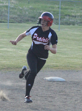Kylie Tidwell tries to stretch a double into a triple against Asotin.