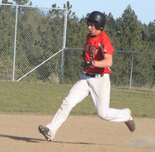 Terran Peery hits a double at Troy.
