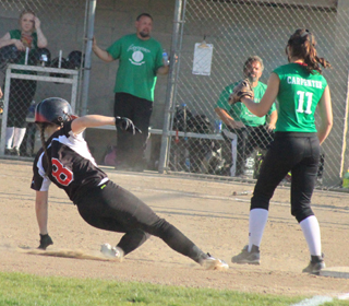 Hailey Danly slides into third with a triple against Potlatch.