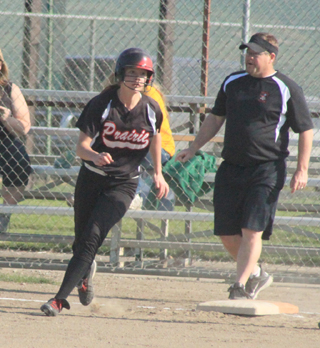 Sarah Seubert rounds first after hitting an RBI single against Potlatch.