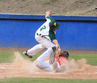 Brandon Anderson dives headfirst into home to score on a wild pitch in the second Potlatch game at District.