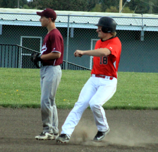 Calvin Hinkelman pulls into second with a double against Kamiah.