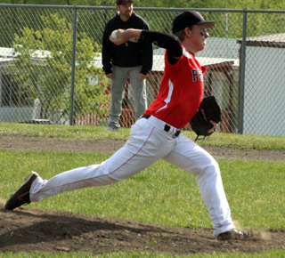 Devin Bruegeman pitches against Kamiah. He also picked up the win against Troy in an elimination game at District.