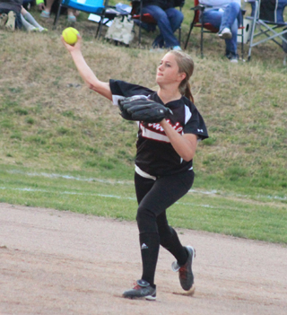 Kylie Tidwell is ready to throw a runner out at first against Potlatch.