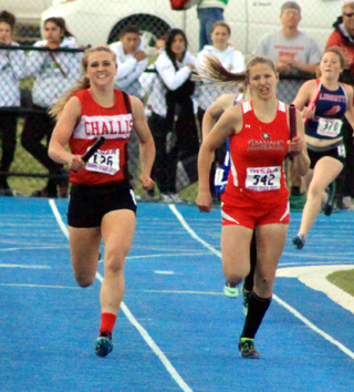 Nicole Poxleitner has just handed off to Shayla VonBargen for the third leg of the 4x200. They placed 2nd to qualify for State.