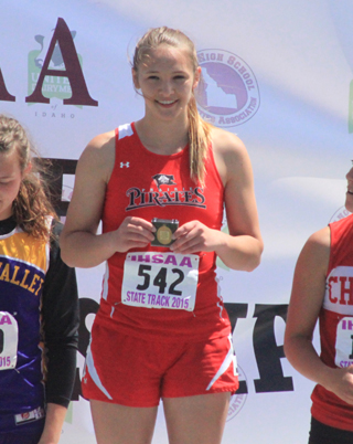 Mykaela McWilliams was Prairies most decorated athlete at the State Track Meet earning 4 medals in 4 events. She had 2 seconds, a third and a fifth. She is shown with the third place medal for the 100 hurdles where she broke the school record.