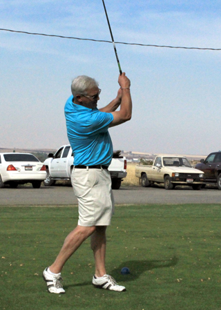 Dan Lustig tees off at the 2014 Golf Tournament. Photo provided by Cheri Holthaus.
