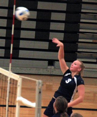 Ally Sonnen goes for a spike.