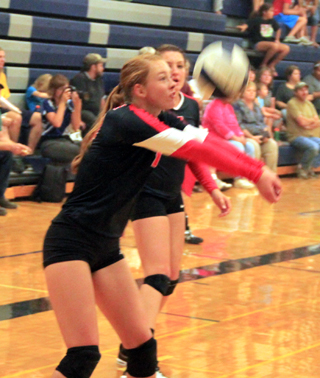 Sarah Seubert makes a pass. Also shown is Shayla Vonbargen.