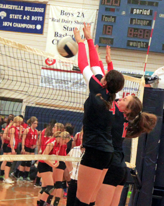 Shayla VonBargen and Angela Wemhoff block a C.V. spike at the Jamboree.