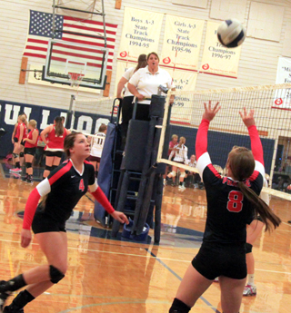 Hailey Danly sets the ball for Shayla VonBargen during the Jamboree at Grangeville.