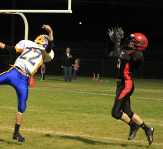 Brandon Higgins intercepts a Salmon River pass near his own goal line.