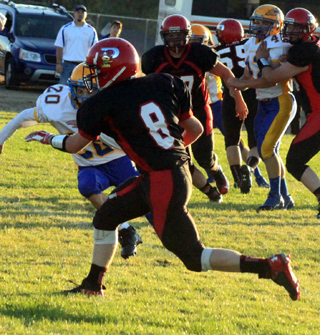 Devin Bruegeman runs with the ball after making a catch over the middle.