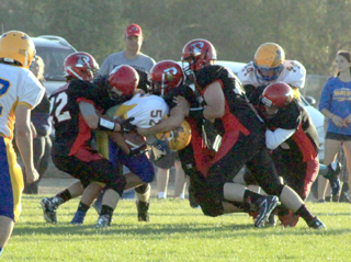 Half of Prairies 8 defenders converged on the Salmon River ballcarrier on this play, stopping him for little to no gain.