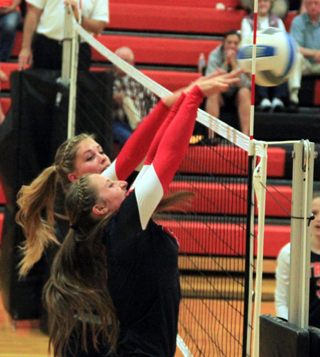 Chaye Uptmor and Hailey Danly go for a block at Troy.