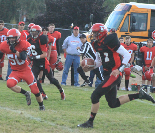 Jake Bruner picks up big yardage in the first quarter to set up the Pirates' first touchdown. #6 is Luke Wemhoff.