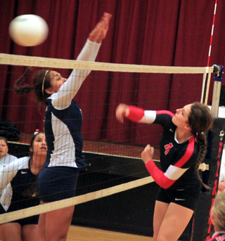 Shayla VonBargen gets a spike past Lapwais blocker.