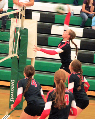 Hailey Danly had the opportunity to be a hitter at Potlatch and scores a kill on this spike. Also shown from left are Shayla VonBargen, Sarah Seubert and Angela Wemhoff, who made the set.