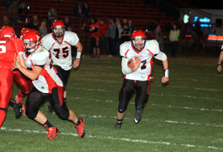 Bobby Hood blocks a C.V. defender leaving Jake Bruner a huge hole to run through for a touchdown. Also shown is Philip Spencer, 75.