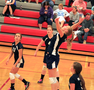 Ally Sonnen goes up for a spike from the back row in the C.V. match. Also shown from left are Rachel Waters, Bridget Beckman and Taylor Lustig.