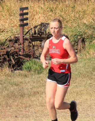 Leah Higgins, left, finished 4th in the JV girls race.