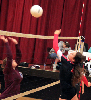 Shayla VonBargen flips the ball away from the blocker.